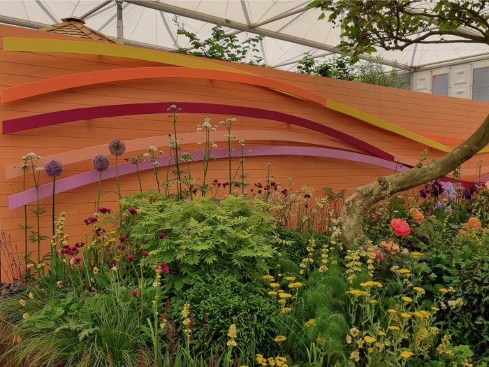 Chelsea Flower Show 2024 orange fence with colourful strips