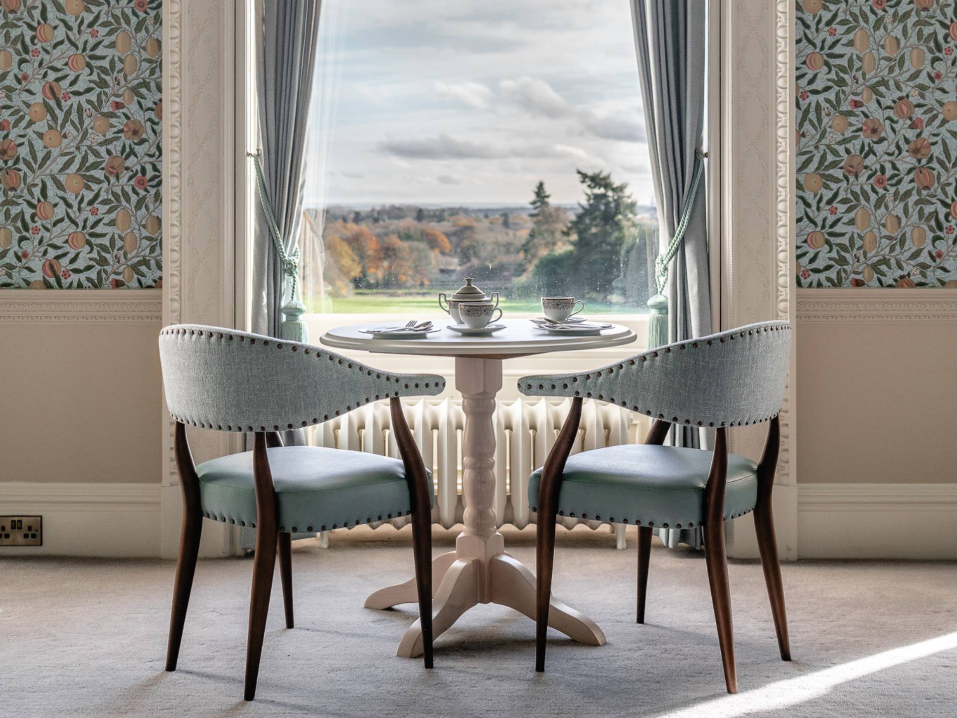 Dining area overlooking view at Heythrop Park hotel