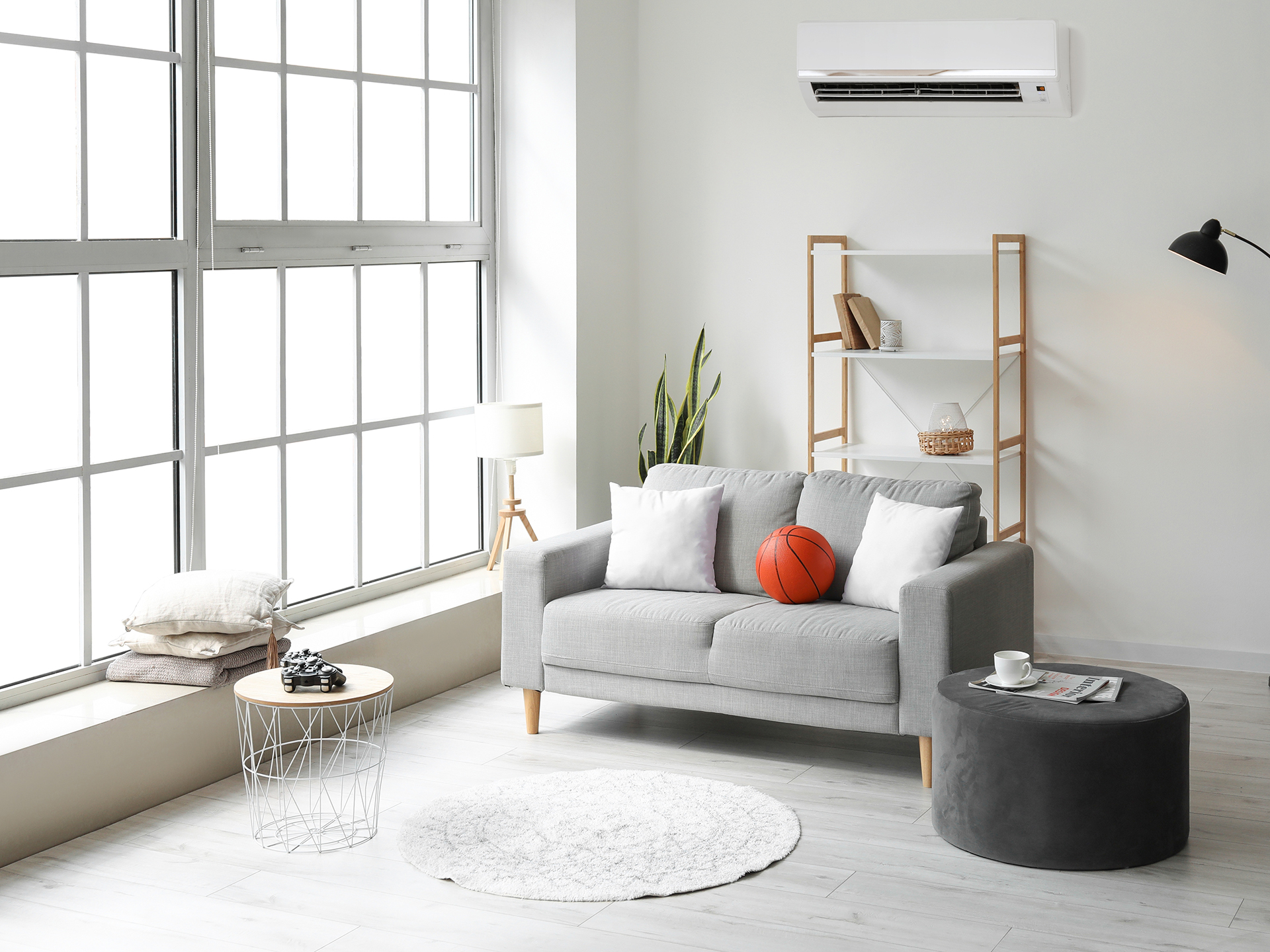 Fixed split AC unit connected to wall