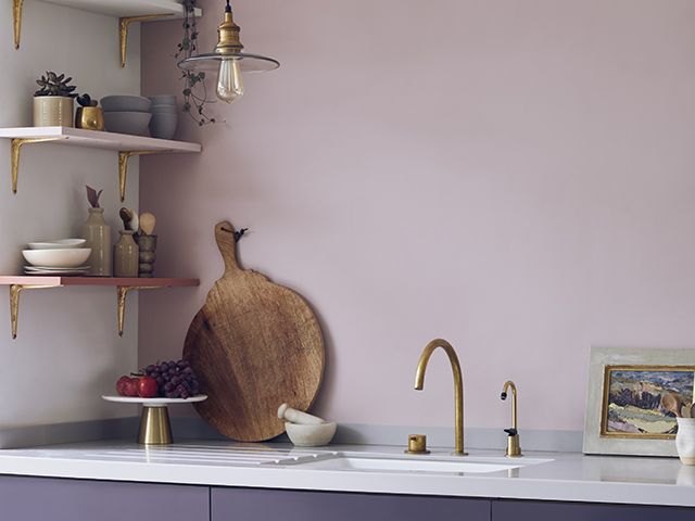 aubergine kitchen with lighter walls and darker cabinets 