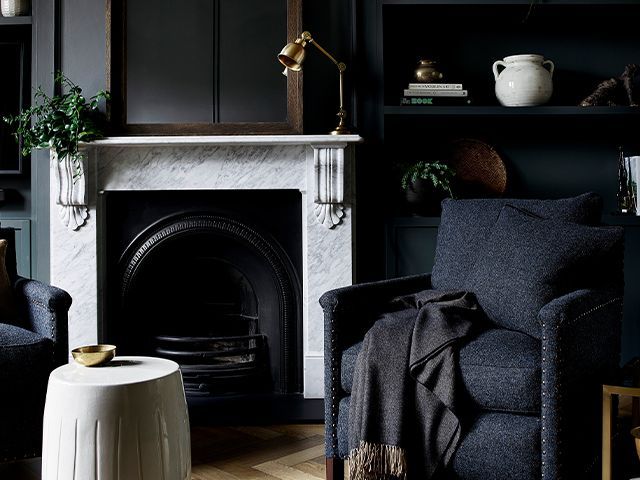 black living room with fireplace