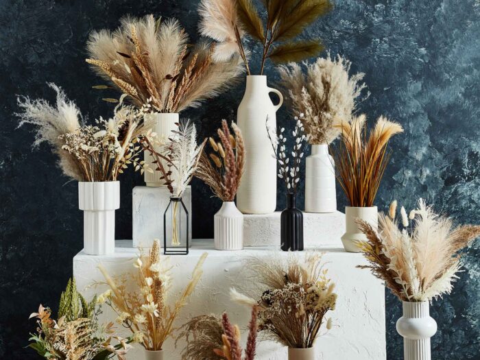 If you want to try grasses, then B&M has a great range for stand alone arrangements or to mix with your artificial flowers