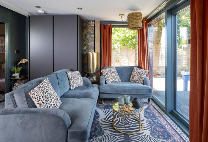 A seating area in the kitchen is Kerry and Paul’s favourite place to relax and the Payton velvet sofas in Petrol Blue by Furniture 123 are complimented by rust velvet curtains from Habitat, with a fun touched added by the Iris Apfel Safari Sapphire rug by Ruggable.