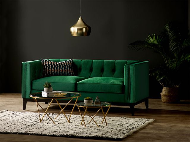 green sofa in black living room - 5 dark interior myths debunked - inspiration - goodhomesmagazine.com
