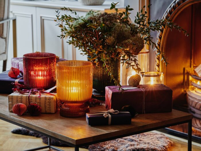 Candles in jewel vases on coffee table