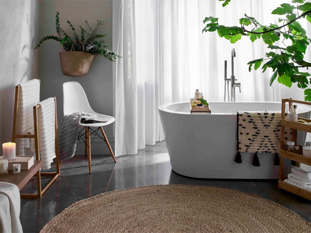 bohemian bathroom with large round jute rug, boho bathmat and bathscaping