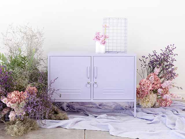 Lilac locker unit with plants in background - Goodhomesmagazine.com