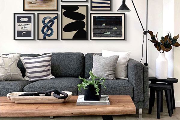 A monochrome gallery wall can add a contemporary touch to a white wall