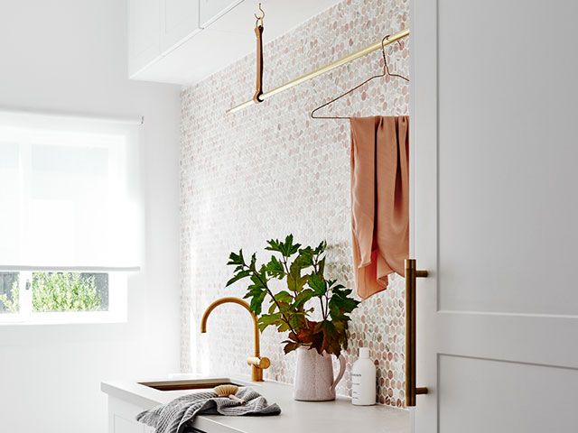Norso laundry room with hanging rail - goodhomesmagazine.com