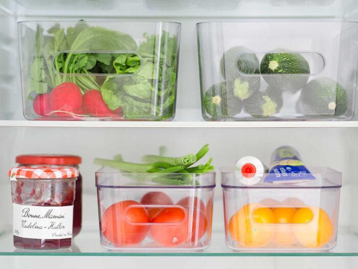 Clear plastic storage units are a good way to organise your fridge so it's easily accessible