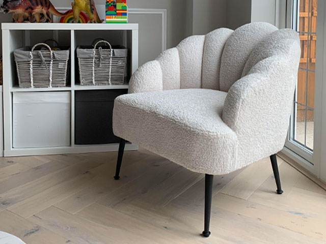 scallop-edged boucle chair in white ivory in children's playroom