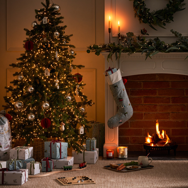 Traditional Christmas set up in living room with open fire