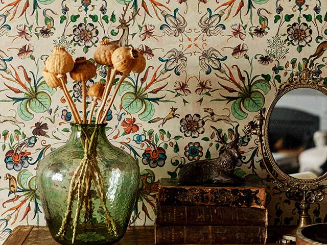 Botanical nature inspired autumn wallpaper behind shelf