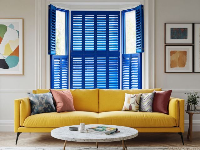 Blue shutters in a living room from Hillarys