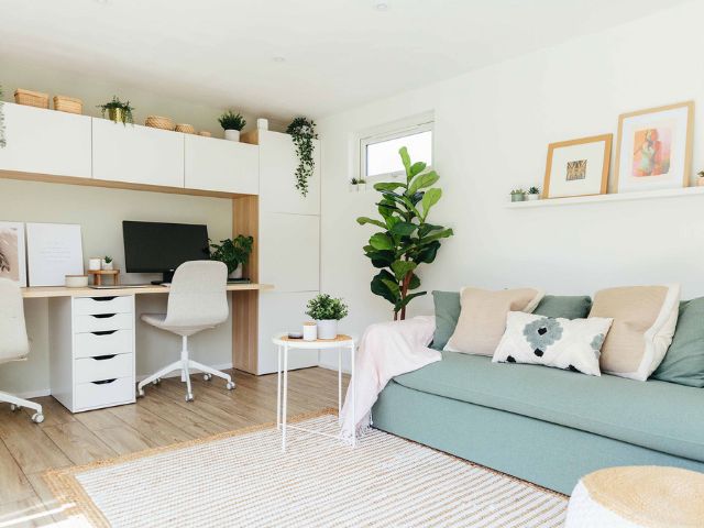 Sofa bed and desk in a spare bedroom